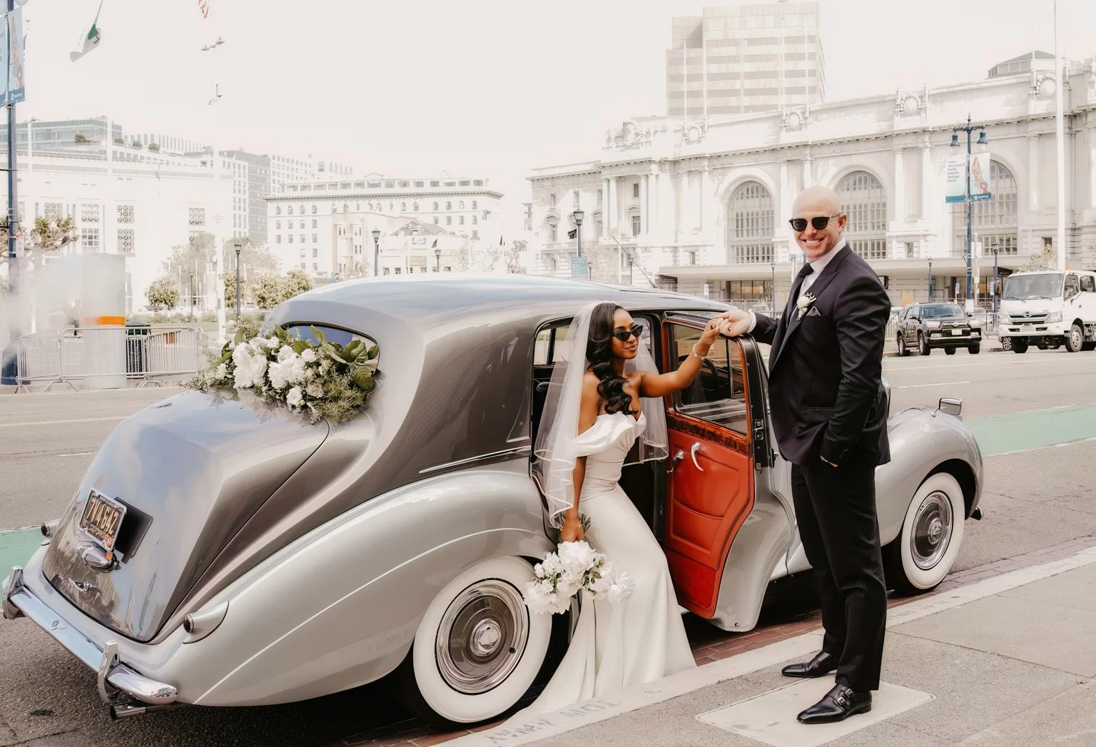 Newlyweds with the Bentley and white flowers in San Francisco